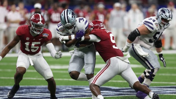 Dec 31, 2022; New Orleans, LA, USA; Kansas State Wildcats running back DJ Giddens (31) runs the ball against Alabama Crimson Tide defensive back Jordan Battle (9) during the first half in the 2022 Sugar Bowl at Caesars Superdome. Mandatory Credit: Stephen Lew-USA TODAY Sports